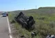FOTO Doi răniți și o mașină răsturnată în urma unui accident 